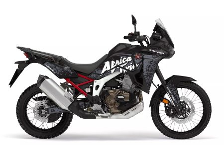 Honda Africa Twin motorcycle with black and grey shard-pattern graphics kit featuring bold Africa Twin lettering.