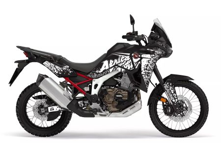 Honda Africa Twin motorcycle with black and white shard-pattern graphics kit featuring bold Africa Twin lettering.